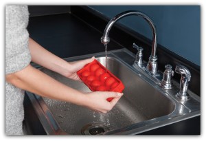 ice ball maker Releasing the Sphere Shaped Ice Cubes from the Cocktail Ice Ball Tray