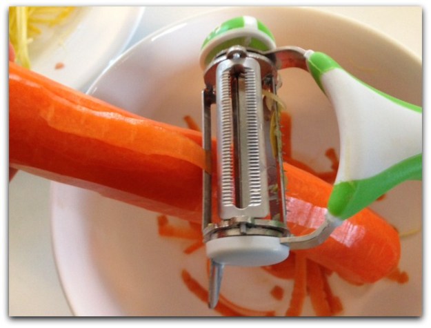 The World's Greatest 3-in-1 Rotational Tri-Blade Peeler Removing Carrot Skin